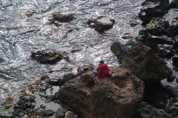 man on a rock