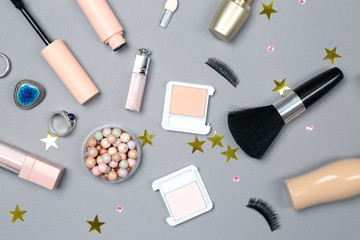 Fototapeta na wymiar Set of makeup cosmetics with accessories on grey background