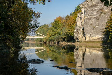 Fototapeta na wymiar The autumn landscape with the Cockerel rock is reflected in the mountain river Psekups. Sunny day in the resort area of Goryachiy Klyuch. Krasnodar region. Excellent natural background for any idea.