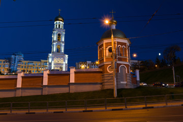 The night picture of beautifully lit white church with gold domes.