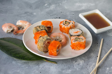 delicious sushi rolls with fresh fish caviar and soy sauce useful