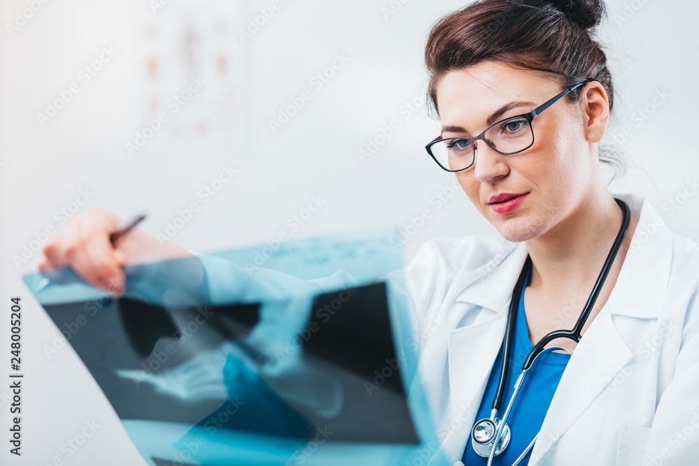 Sticker Radiology Specialist looking at x-ray exam. Friendly woman doctor working in her office