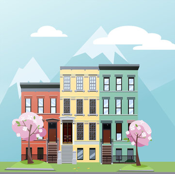 Flat cartoon style vector illustration of spring city street with mountains. Three-story houses with blooming pink trees and grass lawn. Day Street cityscape
