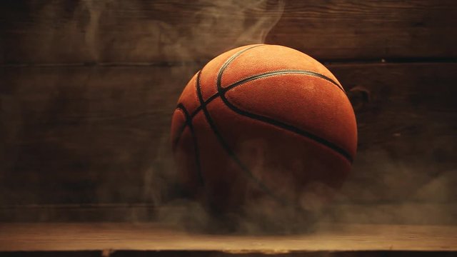 Basketball ball wooden desk smoke hd footage 