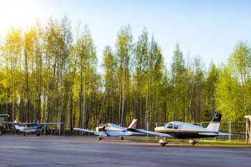 Light passenger planes parked before departure at private airport in Kronshtadt, St.Petersburg,...