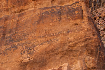 Ancient Thamudic inscriptions on rock in the desert of Wadi Rum, Jordan, Middle East