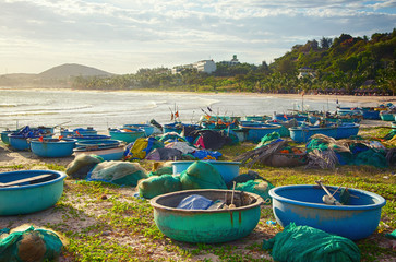 Vietnamese fishing boats on the sandy beach. In the background is the sea. Asia, Vietnam, Mui Ne, Phan Thiet.