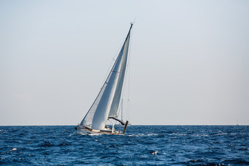 Obraz premium Sailing yacht boat glides on the Sea.