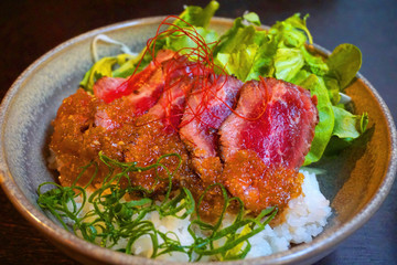  Delicious rice with medium rare beef and lettuce and ginger sauce Japanese traditional food raw slices of beef teriyaki sauce with miso soup bowl Asian cuisine 