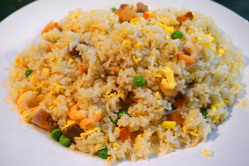  Stir fried rice with beans carrot shrimp pork egg sausage onion beef chillies on white plate Vietnamese traditional food Asian cuisine 