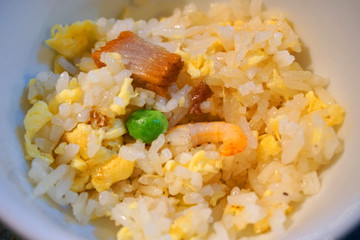  Stir fried rice with beans carrot shrimp pork egg sausage onion beef chillies on white plate Vietnamese traditional food Asian cuisine 