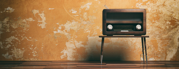 Radio old fashioned on wooden table, oarange wall background, banner, 3d illustration
