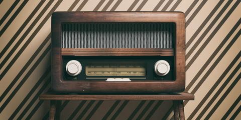 Radio old fashioned on wooden table, retro wall background, 3d illustration