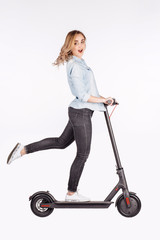 young woman with electric scooter