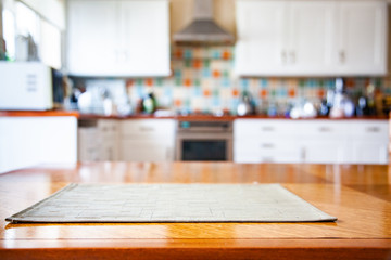 blurred kitchen interior with napkin on table