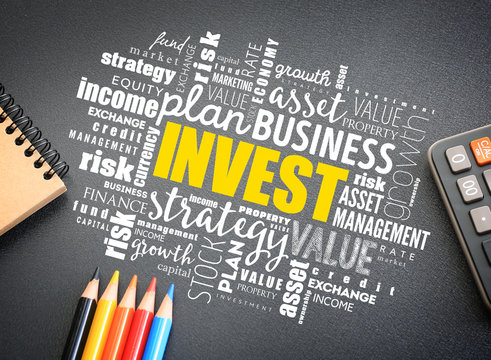 Invest word cloud on the desk, business concept background