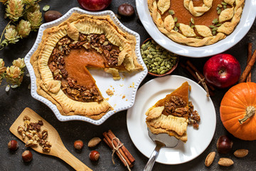 pumpkin pie with nuts, pumpkin seeds and Apple on dark background