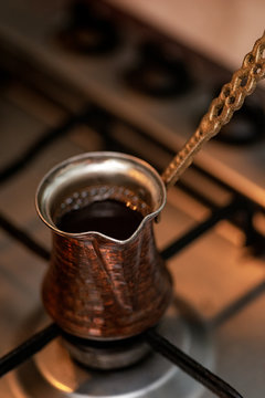 fresh aroma coffee is preparing in the cezve on fire