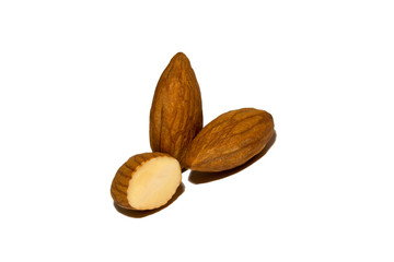 Close-up of almonds. Cut almonds. On white background. Isolated.