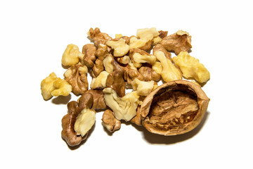 Close-up of walnut. Shell and walnut fruit. On white background. Isolated.