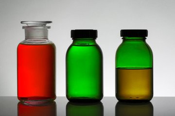 Liquid in laboratory bottles. Scientific biochemical laboratory. Colorful liquid.