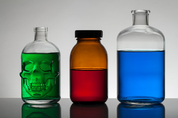 Liquid in laboratory bottles. Scientific biochemical laboratory. Colorful liquid.