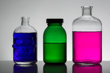 Liquid in laboratory bottles. Scientific biochemical laboratory. Colorful liquid.