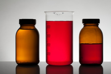 Fototapeta na wymiar Liquid in laboratory bottles. Scientific biochemical laboratory. Colorful liquid.