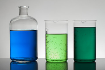 Liquid in laboratory bottles. Scientific biochemical laboratory. Colorful liquid.