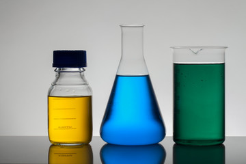 Liquid in laboratory bottles. Scientific biochemical laboratory. Colorful liquid.