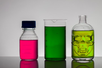 Liquid in laboratory bottles. Scientific biochemical laboratory. Colorful liquid.