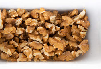 Top view on pieces of dark chocolate in a white tray