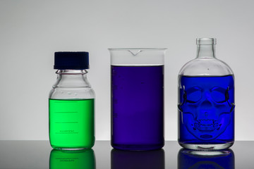 Liquid in laboratory bottles. Scientific biochemical laboratory. Colorful liquid.