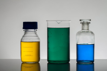 Liquid in laboratory bottles. Scientific biochemical laboratory. Colorful liquid.