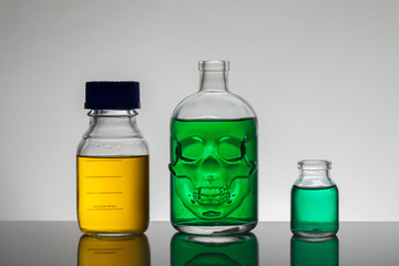 Liquid in laboratory bottles. Scientific biochemical laboratory. Colorful liquid.