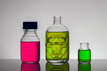 Liquid in laboratory bottles. Scientific biochemical laboratory. Colorful liquid.