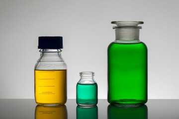 Liquid in laboratory bottles. Scientific biochemical laboratory. Colorful liquid.