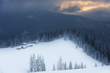 Fototapeta na wymiar Winter, active holidays in the Carpathian Mountains with picturesque huts and plenty of snow.