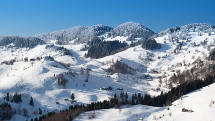Fototapeta na wymiar Romania in the Carpathian mountains , landscape from Transylvania in winter time 