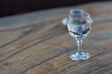 a сup of black coffee and a glass of clean water