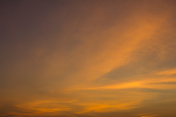 Fototapeta premium yellow orange clouds in a pink blue sunset sky