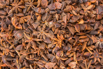 yellow brown spice Badian with a blurred background. natural surface texture