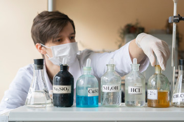 Fototapeta premium young student conduct experiments in universitu in laboratory b