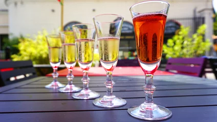 Fotobehang Champagne tasting in the province of Champagne, France. Glasses stand in a row, summer relaxing day © Olya Сhe
