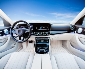 Dark car Interior - steering wheel, shift lever and dashboard. Car modern inside. Front view on...