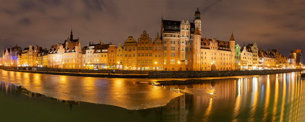 Fototapeta na wymiar Gdansk evening panorama with medieval gates and Old Town facades on the bank of the Motlawa river