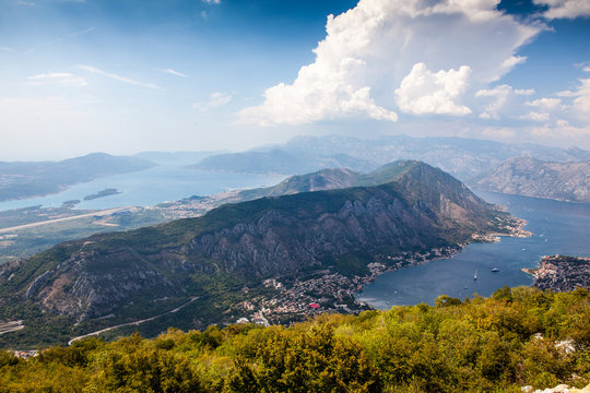 Panoramic view of the airport runway near the city, on the Adriatic Sea, from a great mountain height. Aerial view of Tivat, Kotor Bay, Montenegro.