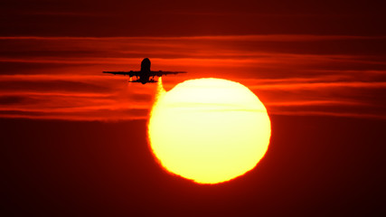 Silhouette of airplane in the sunset 