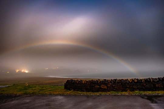 Very rare moonbow during the night above Staffin bay - Isle of Skye, Scotland
