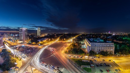 Fototapeta na wymiar Bucharest skyline cityscape with night traffic , Romania 
